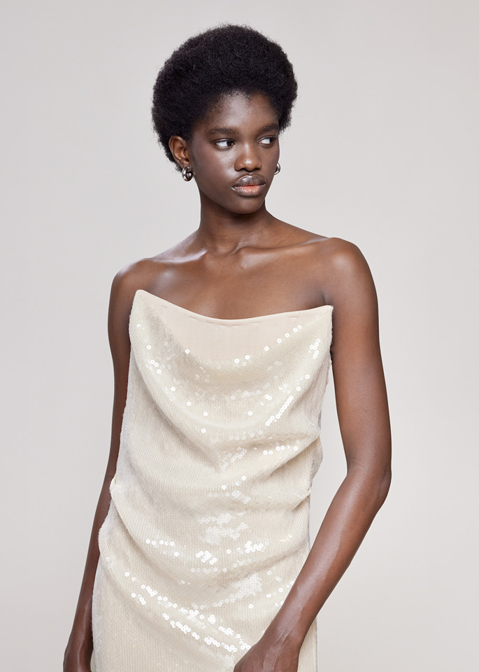 DEL CORE: BUSTIER DRAPED SEQUIN DRESS WITHTOPSTITCH CORSET AND SPLIT ON THE SIDE
