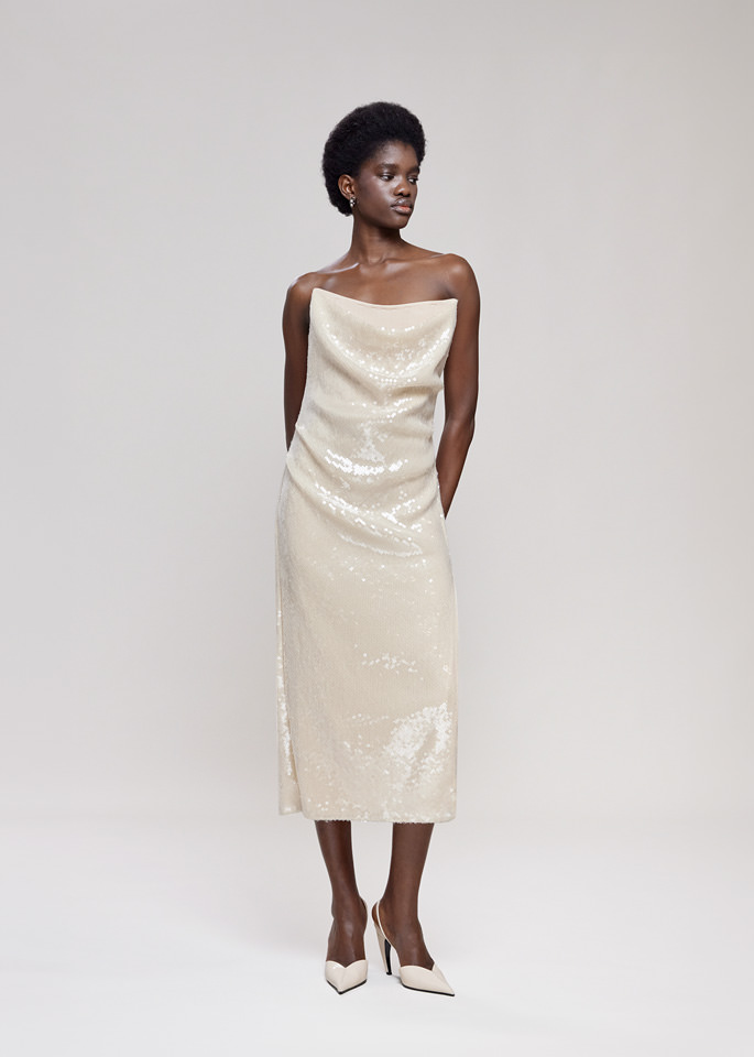 DEL CORE: BUSTIER DRAPED SEQUIN DRESS WITHTOPSTITCH CORSET AND SPLIT ON THE SIDE