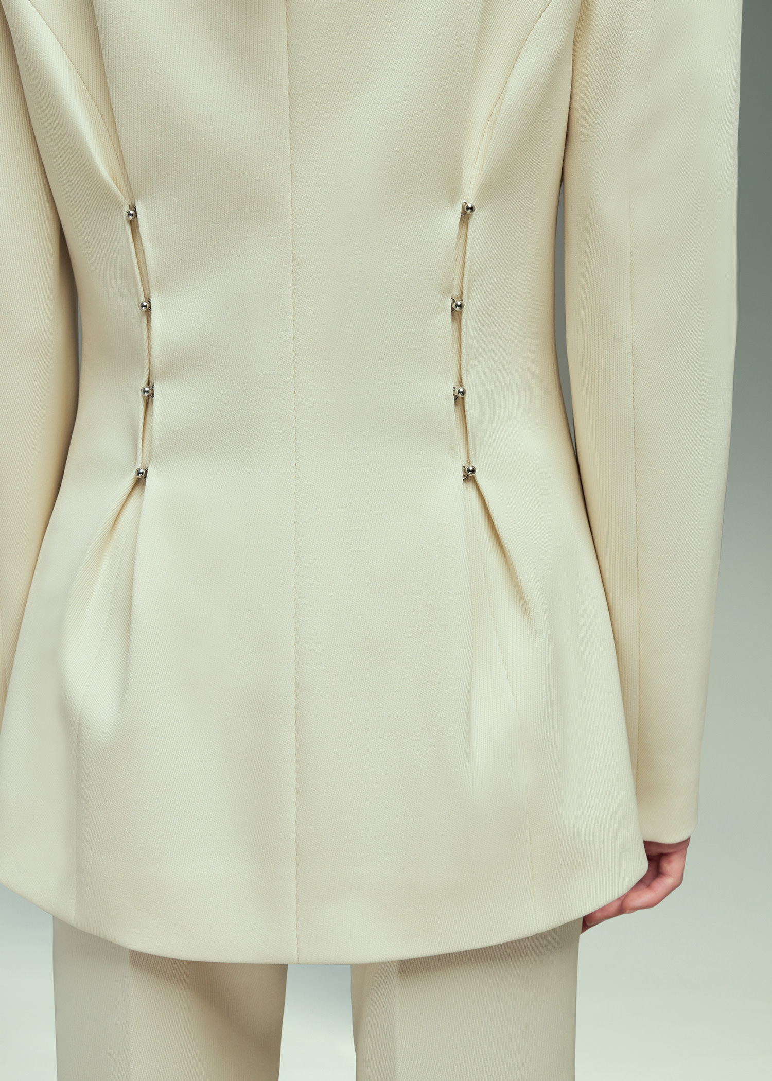 DEL CORE: TAILORED V-NECK JACKET WITH MUSHROOM HOOKS